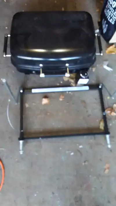 Bbq comes with stand that sits on a table or clips onto rv side rail