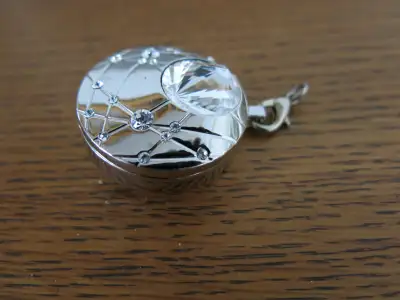 Price is for one LOCKET only each. From a pet free and smoke free home. For sale are 2 (two) SWAROVS...