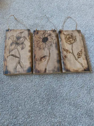 3 Wood burned flower carvings, View more