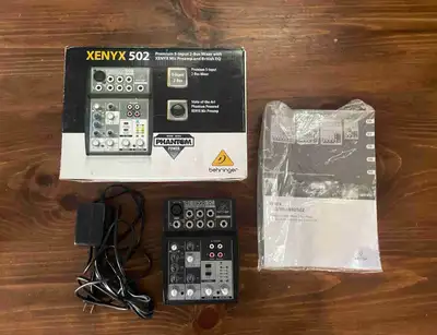Behringer Xenyx 502 5 input, 2 bus mixer with preamps and phantom power. Comes with power supply, ma...