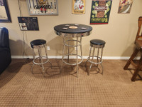 Black and chrome bar table and two matching stools