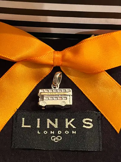 Sterling Silver with Gold Accents Can be used as a charm on a charm bracelet or as a pendant on a ne...