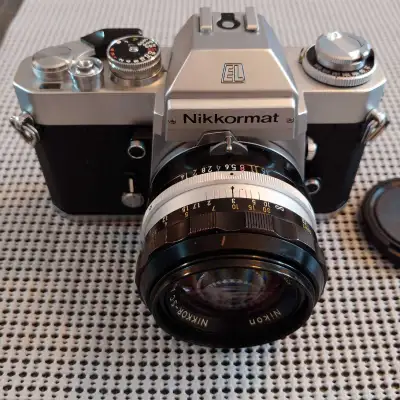 I am selling my Nikon Nikkormat EL manual film camera with Nikon 50mm f/1.4 lens. This camera is ful...