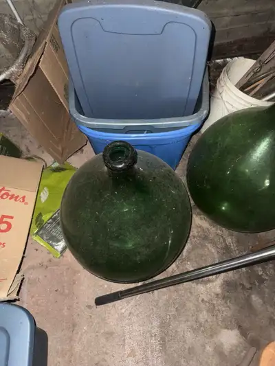 Add a touch of vintage charm to your home with this Villani green glass carboy. Standing at 16 inche...