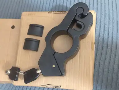 Brand new. Locks both throttle & brake lever. Adjustable brake insert. Cylindrical keys (2). Has rub...