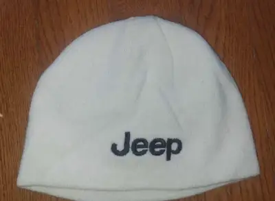 Stay warm with this cream-coloured Jeep toque, perfect for chilly days. This is a used item. It has...
