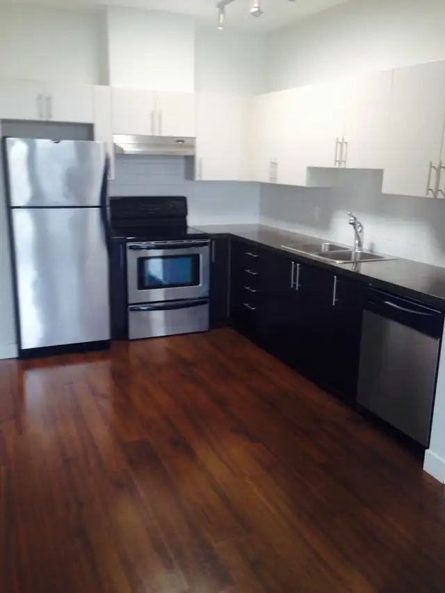UBC University Village 1 BR+Den Top Floor Condo