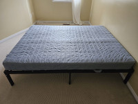 For Sale: Sleek Metal Bed Frame with Mattress!