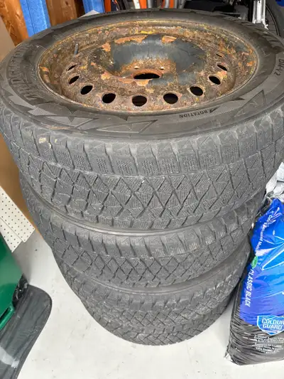 4 Bridgestone blizzak winter tires. 235/60R18. Couple more years of tread left. Comes with the steel...