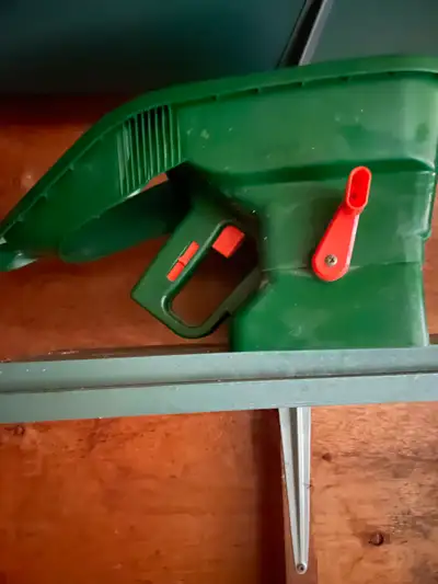 Basic handheld grass seed spreader. Scott’s brand.