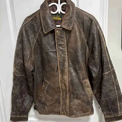 This is a rugged Danier leather jacket in a worn condition, perfect for someone who appreciates a vi...
