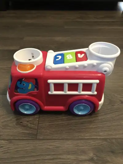 Bright starts roll and pop fire truck, View more