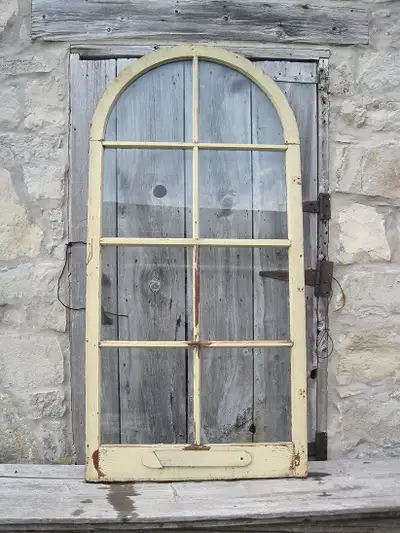 Fancy 8 pane wooden storm window with round top. Second picture shows opposite side. 35 x 72
