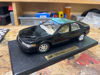 1 Cadillac STS 1:18 scale in original box 1 Lexus RX300 1:24 scale Both are excellent condition-no c...