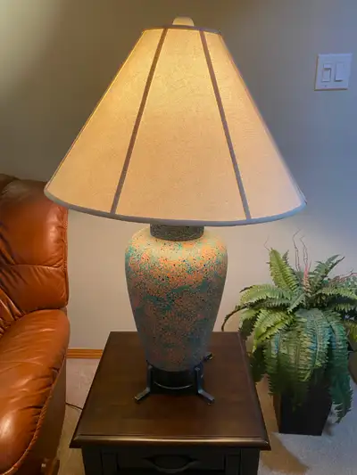 This glazed ceramic table lamp has a wonderful mix of colour. Its classic urn-shaped ceramic base is...