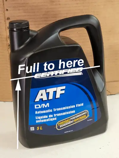 5 litre container of transmission fluid, not full. See photo. No longer needed - have gone electric!