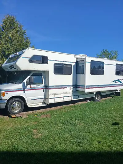 This 1997 RV has very spacious freshly painted interior, with largest slide of its class. The top ha...