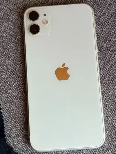 White iPhone 11, always kept in a lifeproof case with tempered glass screen protector. Factory reset...