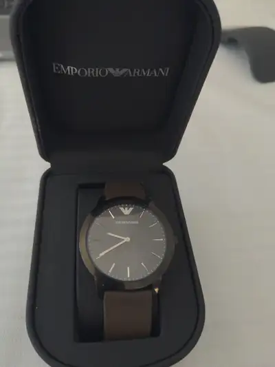 I am selling a super thin Emporio Armani Watch. It feels like a swatch watch for hownthin it is. Per...
