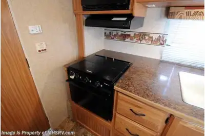 2010 Dutchmen Aerolite 25RBGS with a Slide, Patio Awning, Gas/Electric Water Heater, Pass-Thru Stora...
