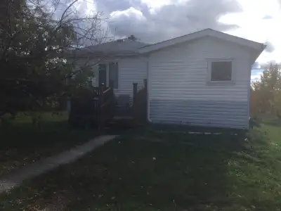 1 bedroom house 24’ x 28’ with attached 8’ x 10’ porch and 8’ x 10’ deck; includes pressure system,...