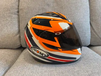Selling my Suomy motorcycle helmet, size large, in used condition. It's a high-quality helmet with a...