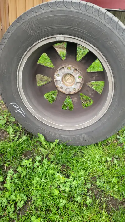 225/65R17 102H Michelin Defender tires date code 0818, lots of tread left, some cracking between tre...