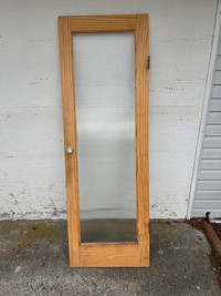 Glass door with wood frame
