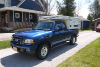 2007 Ford Ranger with "Four Wheel Campers" brand pop up camper