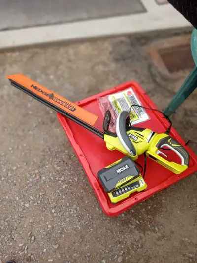 40 volt, rotating handle 24" trimmer in excellent condition, used once with 2ah lithium battery & ch...