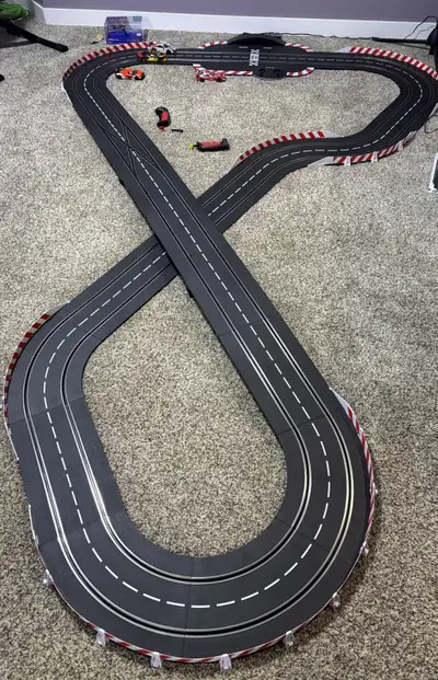 Carrera Slot Car Track with 4 cars, remote wireless controllers, Starting setup with Laptimer additi...