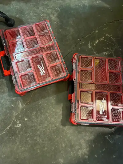 For sale are two sturdy red storage boxes.