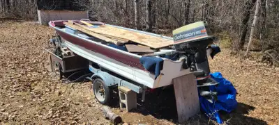 Boat, motor and trailer Motor will not turn over( Seized) Was okay when stored for the winter three...