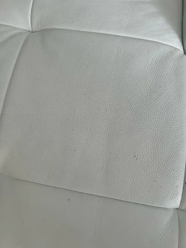 white couch with cat stratches on it63009267823873122