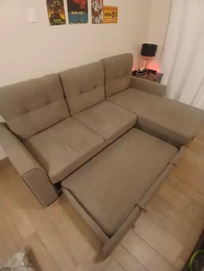 Couch for sale. Folds out into a larger couch, View more