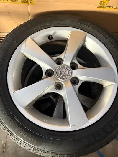 Matching set of 4 x Mazda rims and tires Hydro edge motomaster, still in great condition size 205/55...