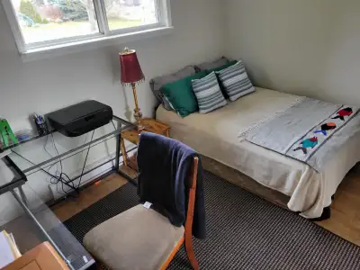 The private room has a double bed, tv, large closet and a desk with a printer, cieling fan and elect...