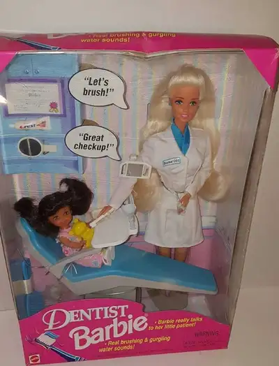I'm offering a Dentist Barbie doll, still in its original packaging, which is in used condition. Thi...