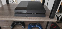 Ps4 with 2 controllers and 2 games 