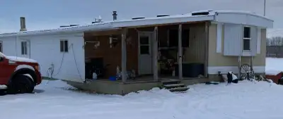 Mobile with full size addition including a small deck. 4 bedrooms, large living room and large pantr...
