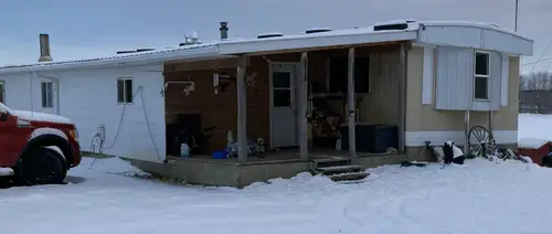 Mobile with full size addition including a small deck. 4 bedrooms, large living room and large pantr...