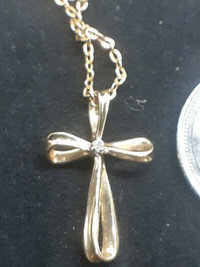 10k Gold Cross Pendant Designer made with a small Diamond center