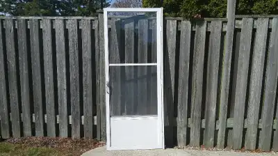 Used Storm door white 32x79 that was used to cover a wooden exterior door. Comes with the following...