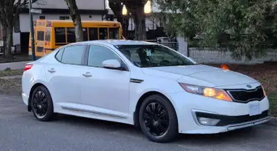 2012 Kia Optima Hybrid automatic Pearl white metallic paint Black leather interior, reverse camera,...