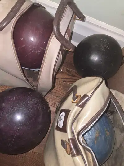 4 used bowling balls various weights