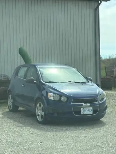 Blue 2013 Chevy sonic, good condition needs breaks though. 242866 kms on it! Updated this year- New...