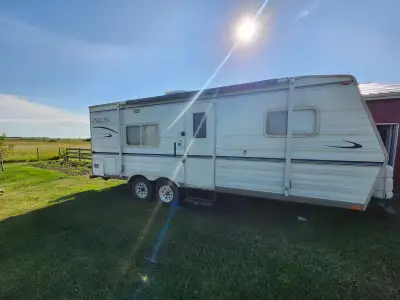 2005 Orion 21’ RV camper trailer. Queen bed in bedroom up front. Fold down table and couch. New awni...