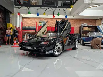 This 1:18 scale Lamborghini Countach diecast car is a fantastic addition to any collection, showcasi...