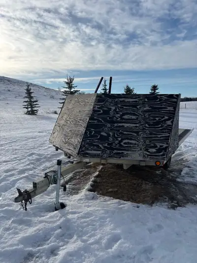 Two place sled trailer for sale. Deck is in good condition. New jack and tires last season.New spare...