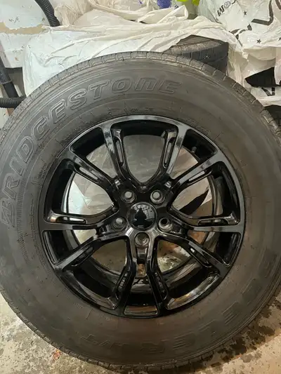 I am selling a set of four Bridgestone Dueler H/T tires with rims, size 255/70R18. These tires were...
